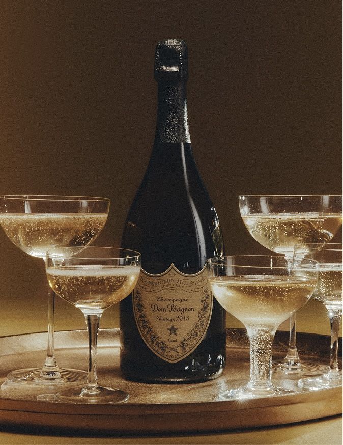 Dom Pérignon bottle and filled Champagne coupes